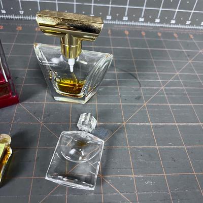 4 Little Perfume Bottles. 