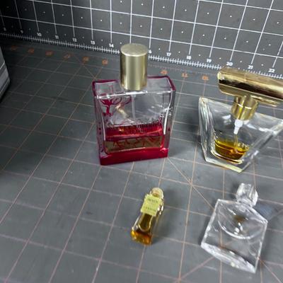 4 Little Perfume Bottles. 