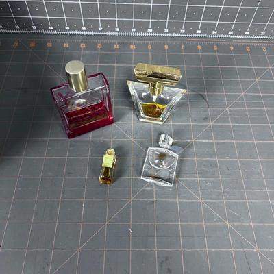 4 Little Perfume Bottles. 