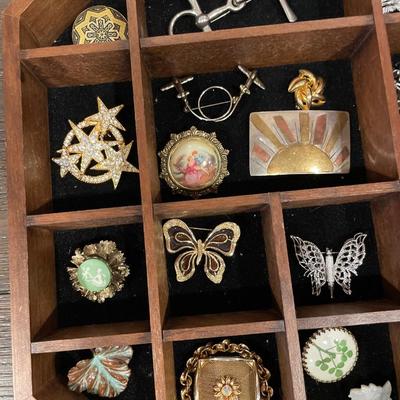 Wood & glass top display case with 34 brooches