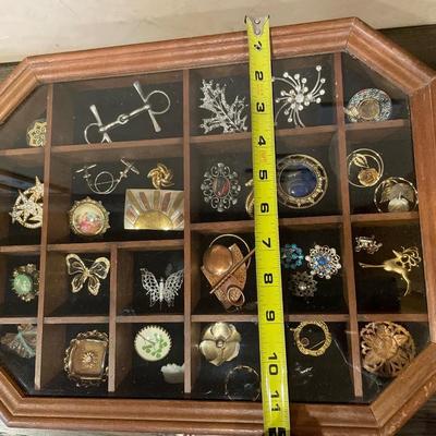 Wood & glass top display case with 34 brooches