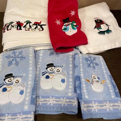 Snowman and penguin towels