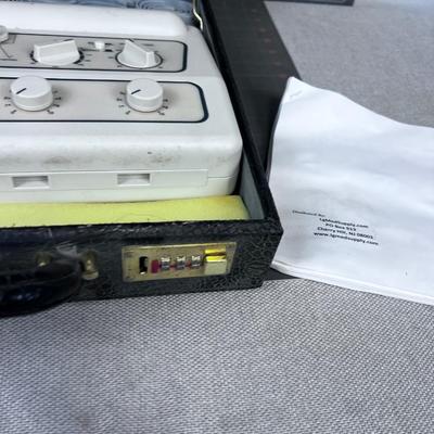Tens Pain Relief Machine in CASE, comes in a Black Alligator Skin Faux Case. 