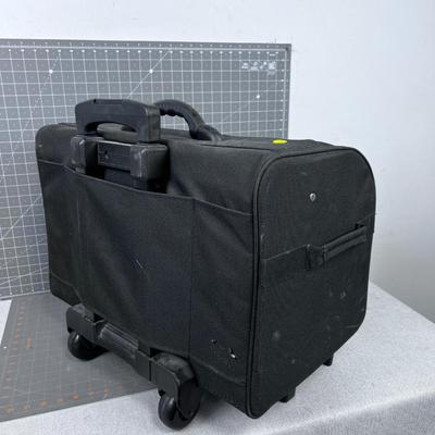 Bernina Sewing Machine and Accessory Case - Rolling and has a Handle.