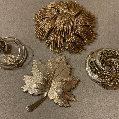 Large gold tone brooches
