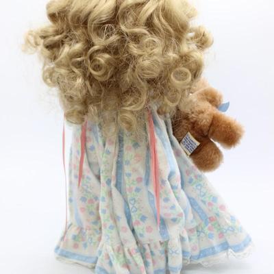 Vintage Doll with toy bear attached