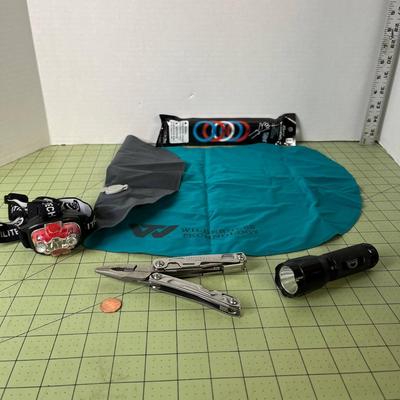 Outdoorsman Bundle Headlamp, flashlight, Leatherman, inflatable pillow, and glowsticks