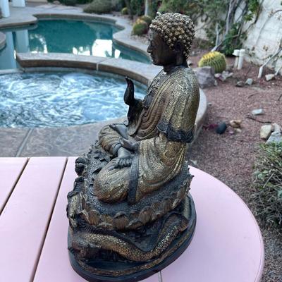 25.  ANTIQUE CAST BRONZE BUDDAH SEATED ON DRAGON THRONE TIBET