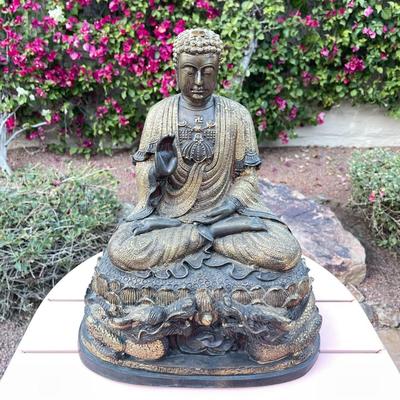 25.  ANTIQUE CAST BRONZE BUDDAH SEATED ON DRAGON THRONE TIBET