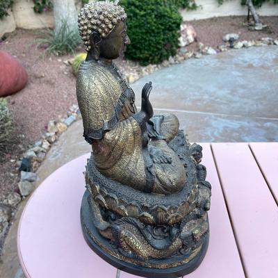 25.  ANTIQUE CAST BRONZE BUDDAH SEATED ON DRAGON THRONE TIBET