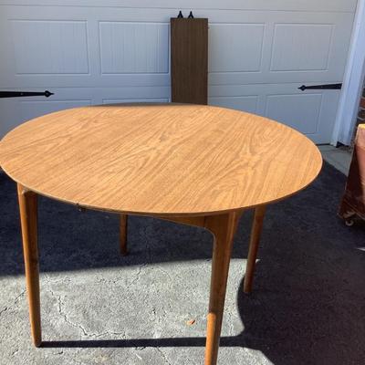 Wooden round table with vinyl top 30"H 41"diameter 10.5" leaf