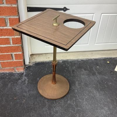 MId-century side table with ashtray opening, metal base, wooden part of the leg, vinyl covered top 21"H 15"x15"
