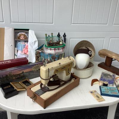 Vintage wig case head form and hat, Singer sewing machine w/foot pedal, table top ironing board, puzzle NIB, doll