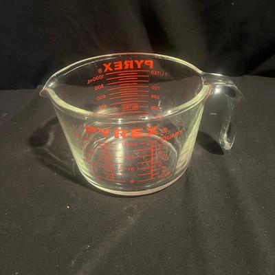 Four Pyrex Measuring Cups (K-MG)