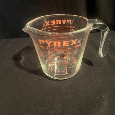 Four Pyrex Measuring Cups (K-MG)
