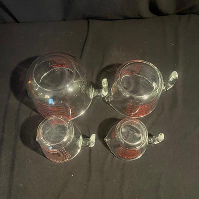 Four Pyrex Measuring Cups (K-MG)