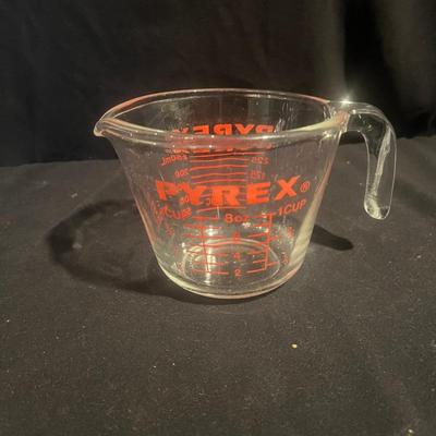 Four Pyrex Measuring Cups (K-MG)