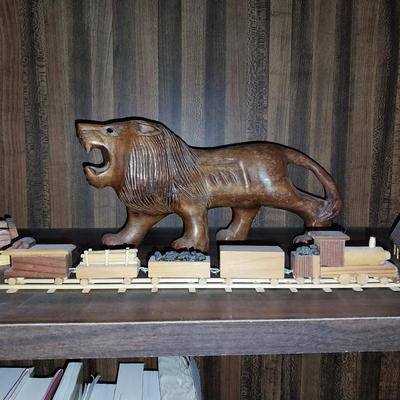 WOODEN CARVED LION, TRAIN AND MINIATURE BUILDINGS