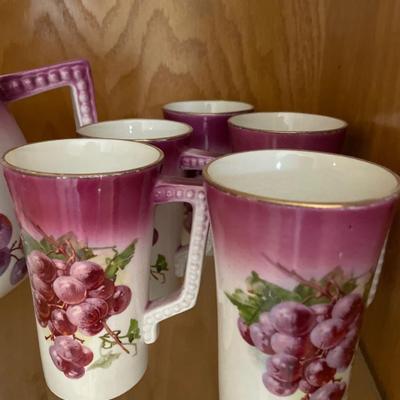 Large porcelain grape pitcher and 5 glasses