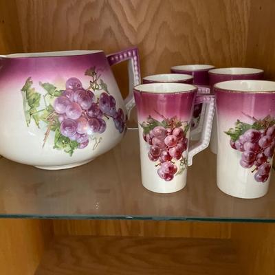 Large porcelain grape pitcher and 5 glasses