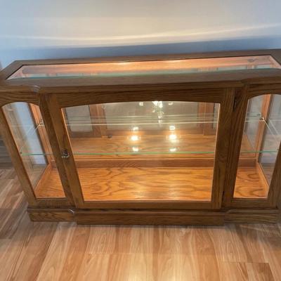 Glass lighted curio cabinet