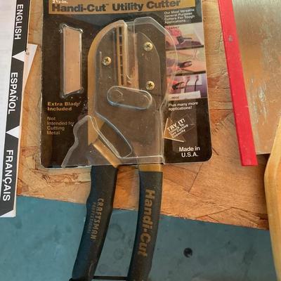 Work light, utility cutter and mitre hand saw