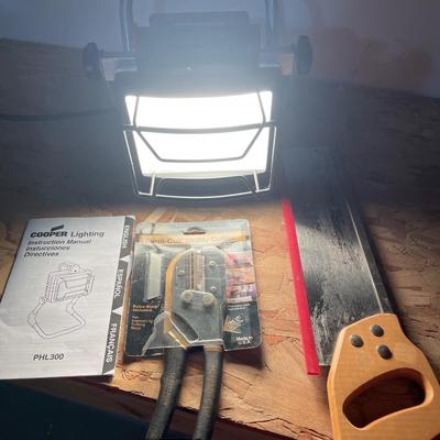 Work light, utility cutter and mitre hand saw