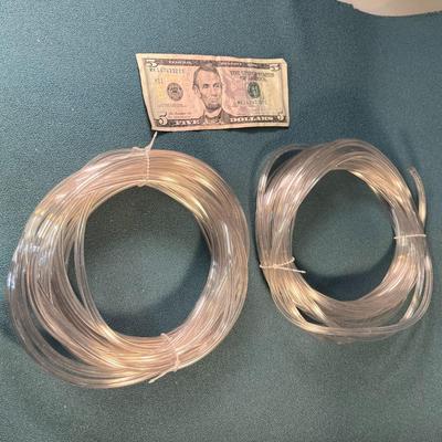 2 COILS OF 1/4" CLEAR PLASTIC TUBING 25 FEET EACH