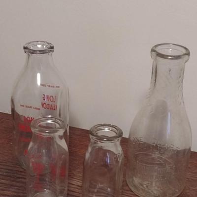 Set of Four Milk Bottles includes Guilford, Sunrise, Long Meadows Dairies