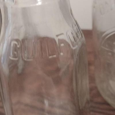 Set of Four Milk Bottles includes Guilford, Sunrise, Long Meadows Dairies