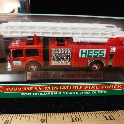 NEW HESS FIRE TRUCK AND A SMALL RADIO FLYER WAGON