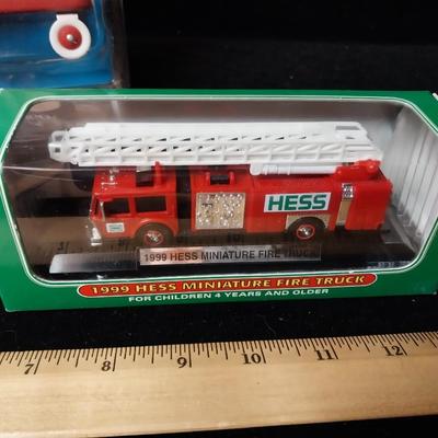 NEW HESS FIRE TRUCK AND A SMALL RADIO FLYER WAGON