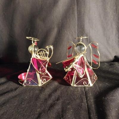 FOUR ANGEL CANDLE HOLDERS AND ROCKING HORSE CANDLES