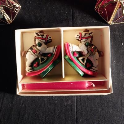 FOUR ANGEL CANDLE HOLDERS AND ROCKING HORSE CANDLES