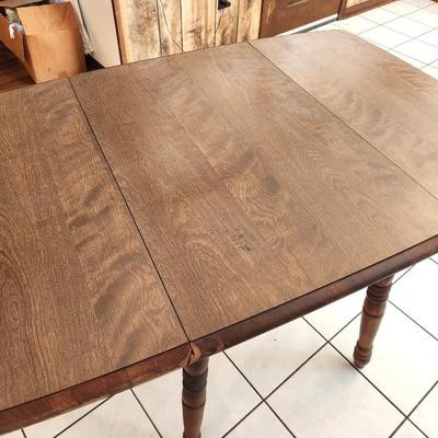 Lot #97  Vintage Drop Leal Table, marked "Rockingham"