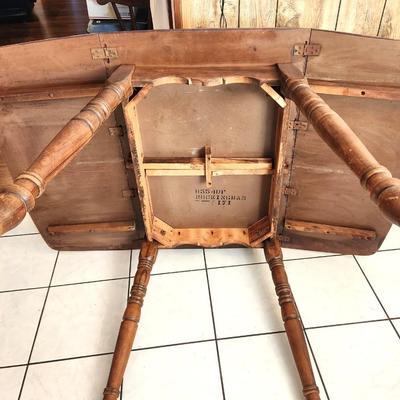 Lot #97  Vintage Drop Leal Table, marked "Rockingham"