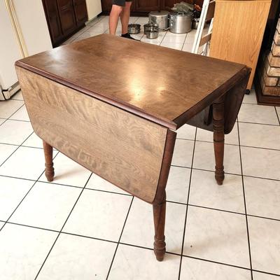 Lot #97  Vintage Drop Leal Table, marked "Rockingham"