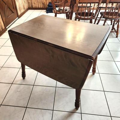 Lot #97  Vintage Drop Leal Table, marked "Rockingham"