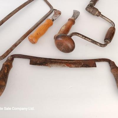 Variety of vintage hand tools - wooden handles - saw - drill - draw knife