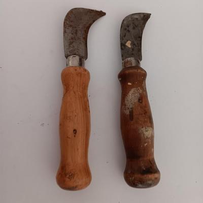Variety of vintage hand tools - wooden handles - saw - drill - draw knife
