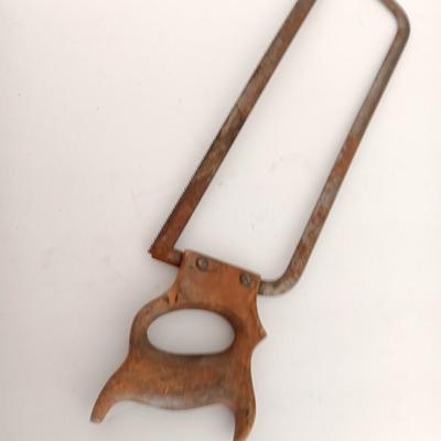 Variety of vintage hand tools - wooden handles - saw - drill - draw knife
