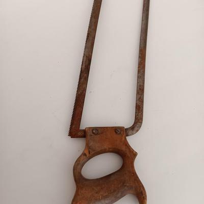 Variety of vintage hand tools - wooden handles - saw - drill - draw knife