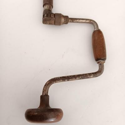 Variety of vintage hand tools - wooden handles - saw - drill - draw knife