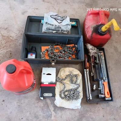 Plastic toolbox full of Chainsaw tools with Jug of bar and saw chain lubricant and a gas can