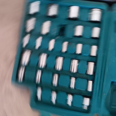 Two incomplete tool kits in organizing boxes -