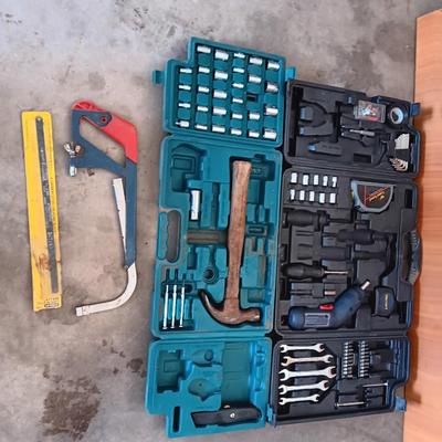 Two incomplete tool kits in organizing boxes -