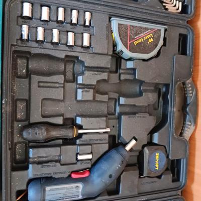Two incomplete tool kits in organizing boxes -