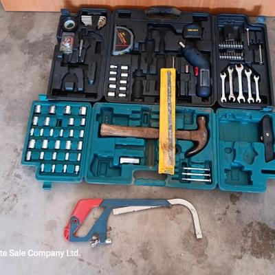 Two incomplete tool kits in organizing boxes -