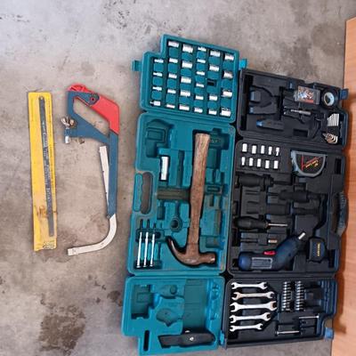 Two incomplete tool kits in organizing boxes -