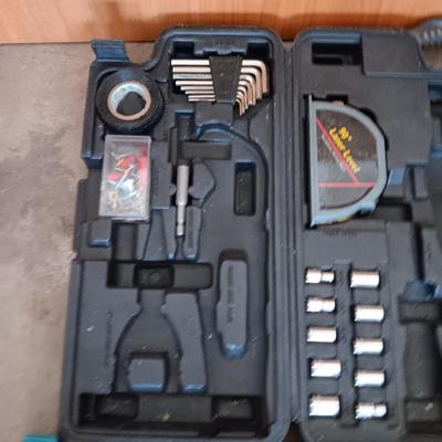Two incomplete tool kits in organizing boxes -